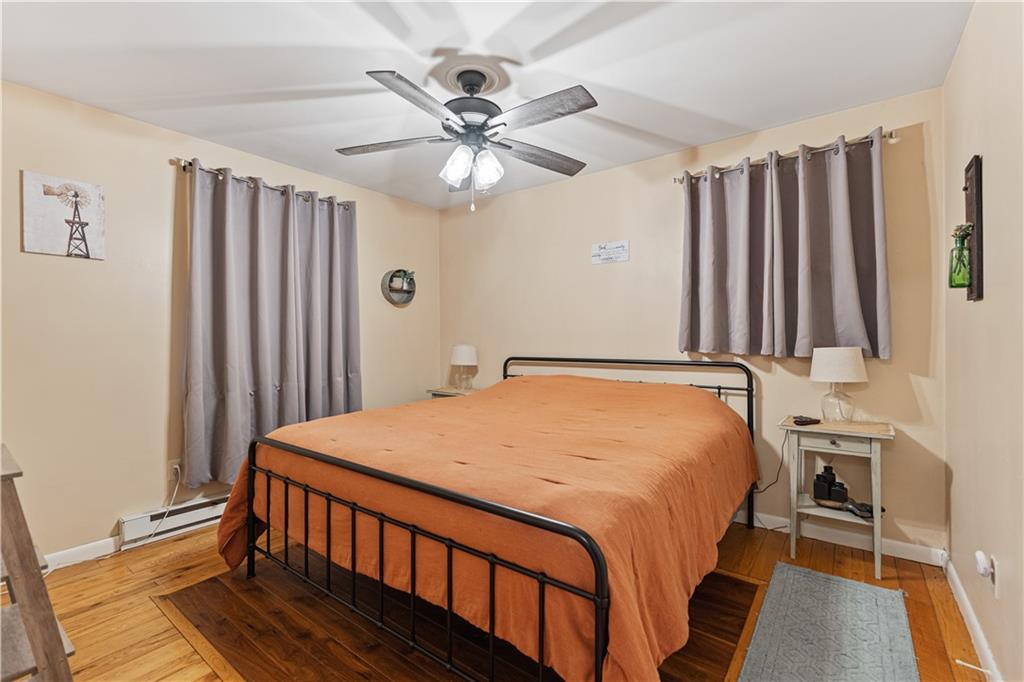 261 Casselman Road Markleton, PA 15551 - Photo 33 of 42 a bedroom with a bed and a chandelier