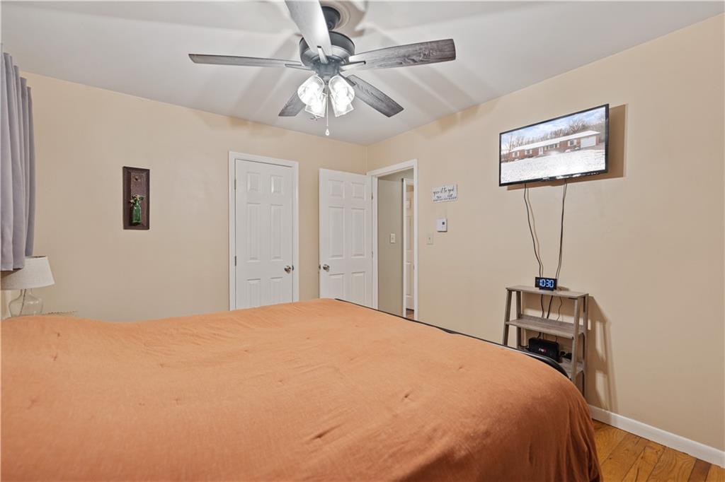 261 Casselman Road Markleton, PA 15551 - Photo 34 of 42 a bedroom with a bed and a chandelier