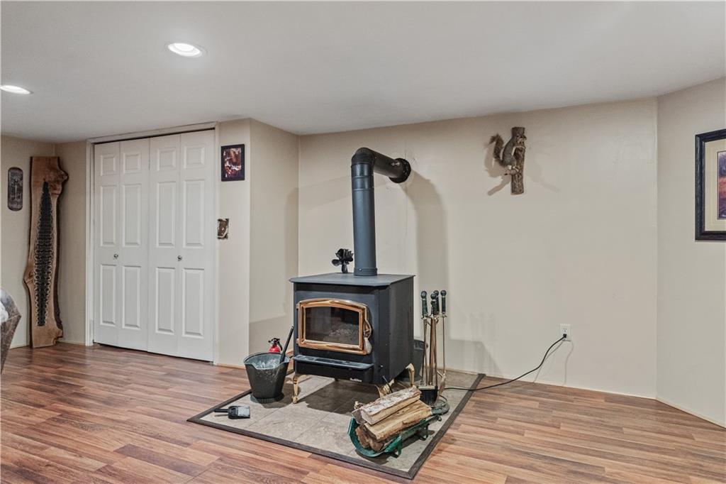 261 Casselman Road Markleton, PA 15551 - Photo 37 of 42 a view of a livingroom with hardwood floor and a fireplace