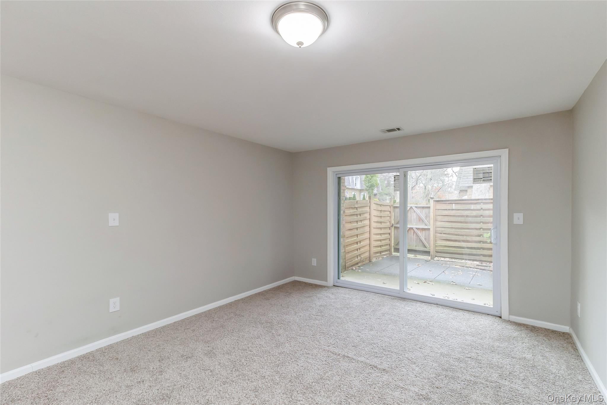 655 Middle Country Road, Unit 4D1 Coram, NY 11727 - Photo 11 of 27 an empty room with windows