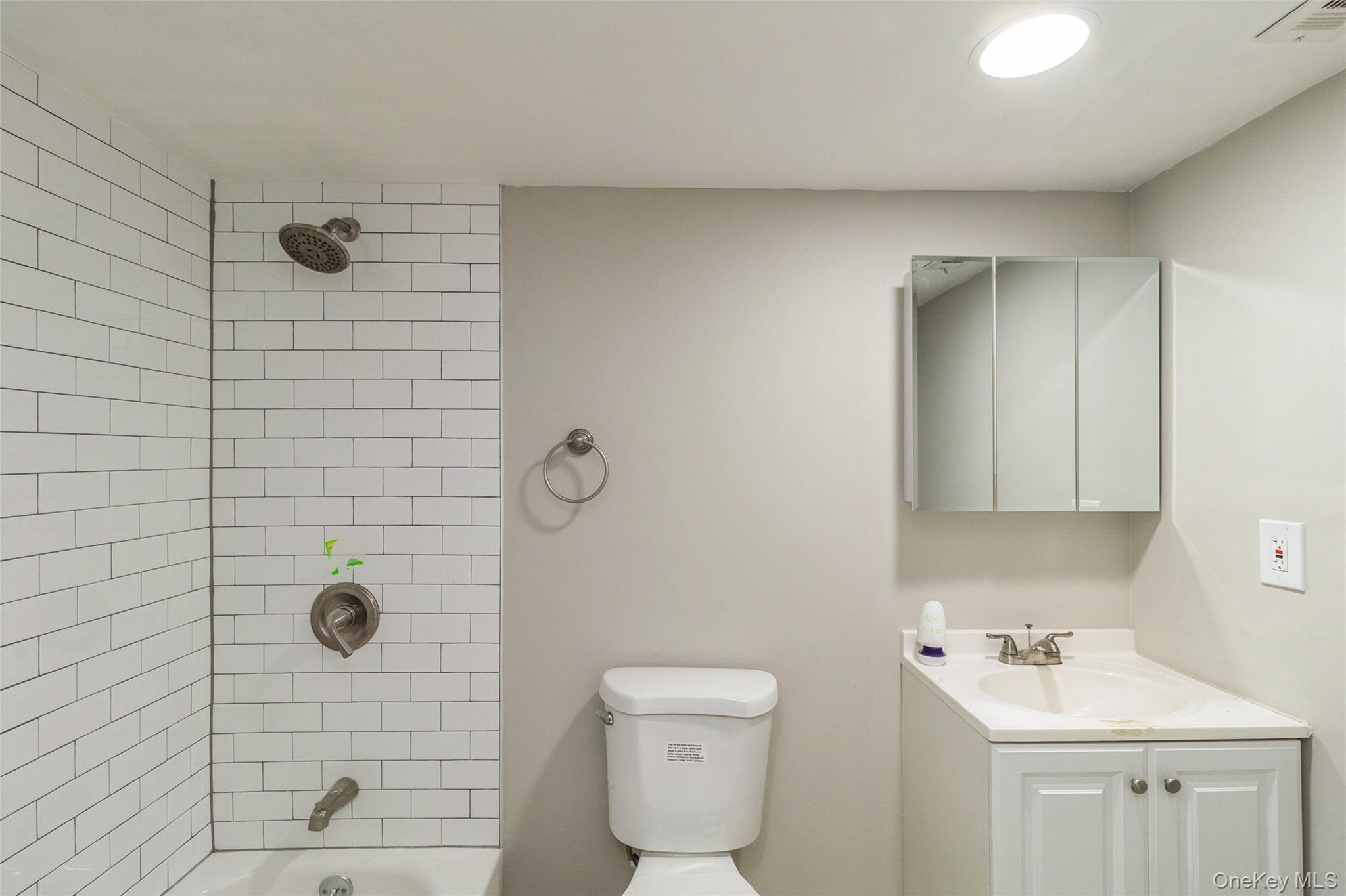 655 Middle Country Road, Unit 4D1 Coram, NY 11727 - Photo 22 of 27 a bathroom with a shower
