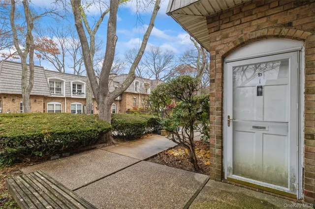 a view of a brick house with a yard