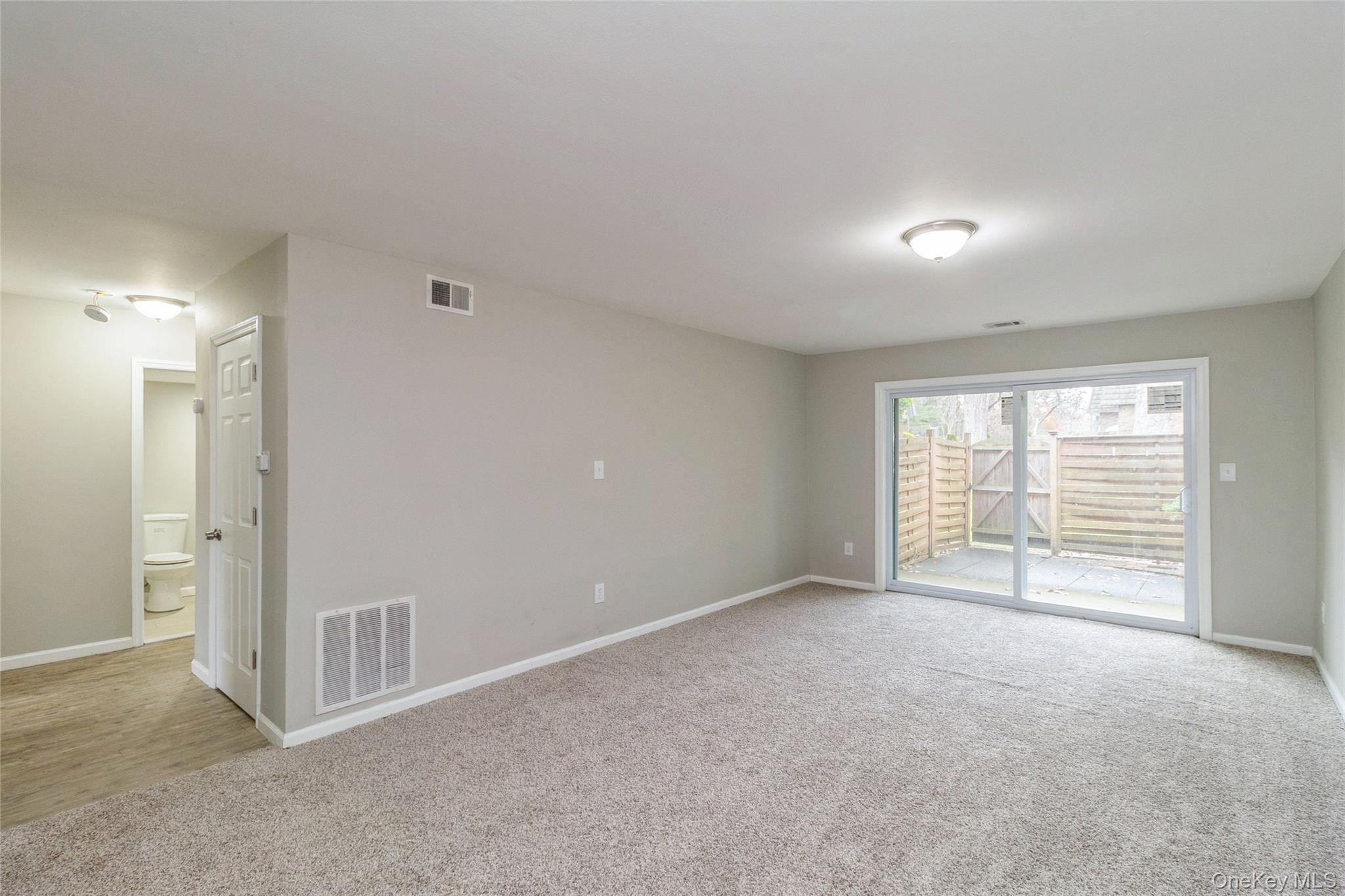 655 Middle Country Road, Unit 4D1 Coram, NY 11727 - Photo 7 of 27 a view of an empty room with a window