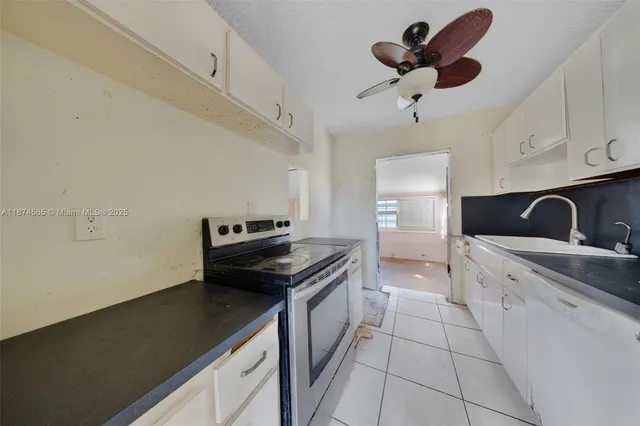 a kitchen with a cabinets and appliances