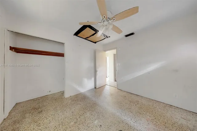 a view of a backyard with a swimming pool