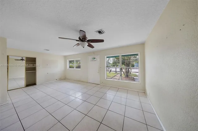 a view of an empty room with a window
