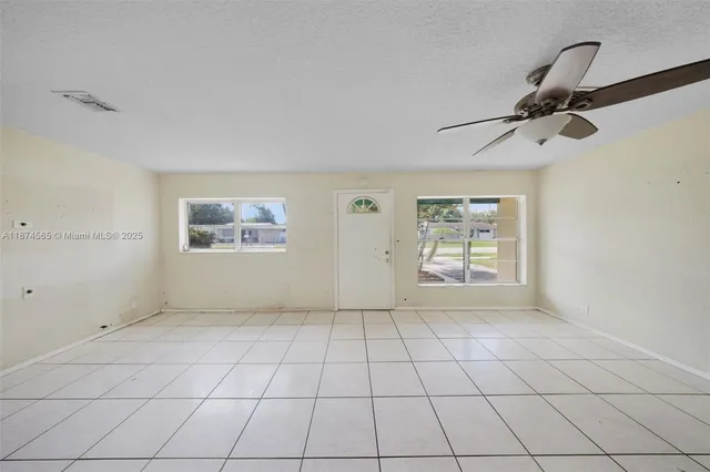 a view of an empty room and window