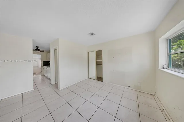 a view of an empty room and window