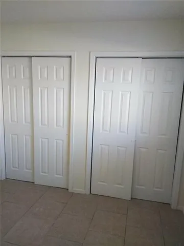 an empty room with a wooden door