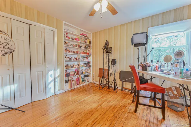 a view of a livingroom with furniture window and wooden floor