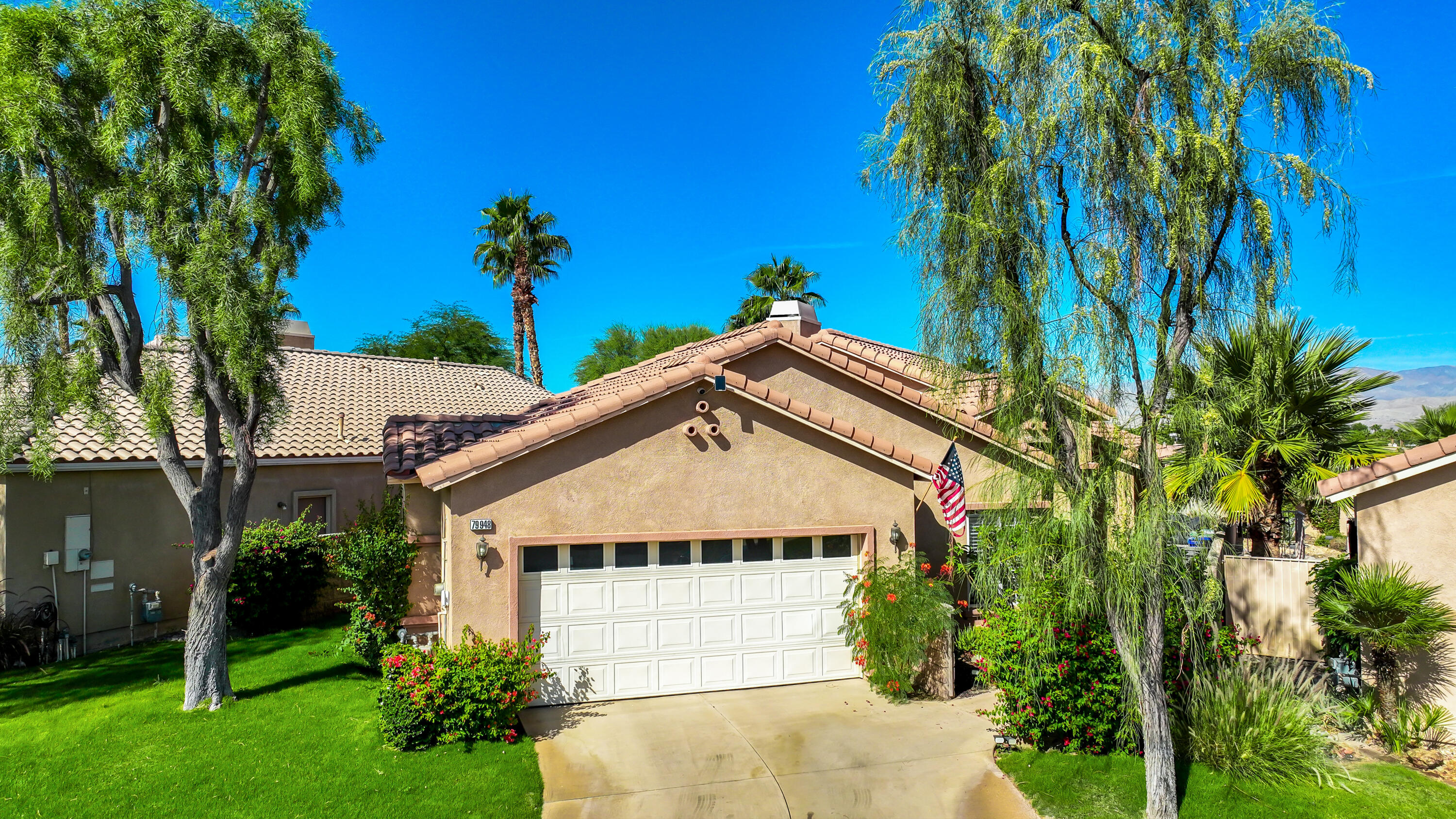 79948 Bethpage Avenue Indio, CA 92201 - Photo 1 of 30 a view of house with palm trees