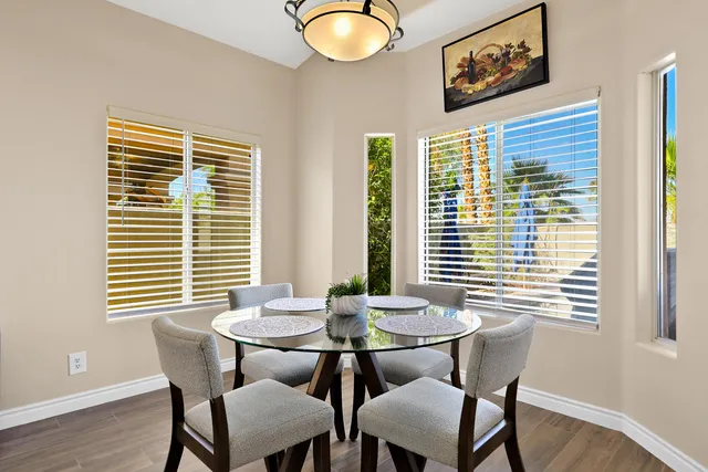 a view of a dining room with furniture and windows