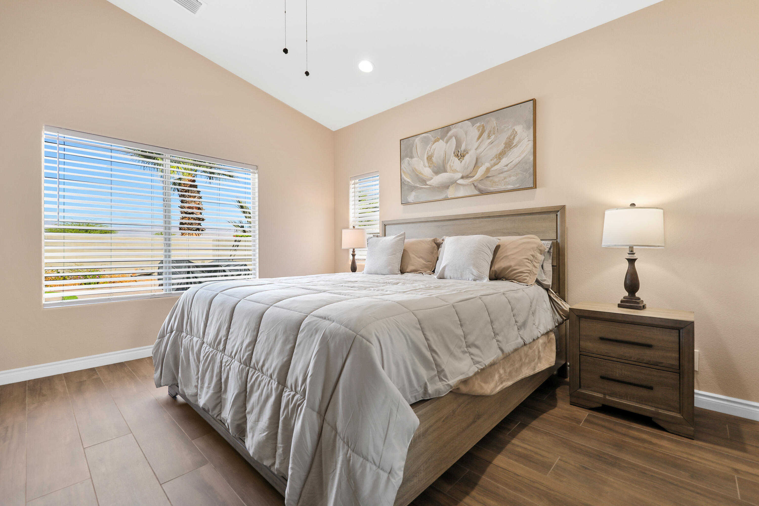 79948 Bethpage Avenue Indio, CA 92201 - Photo 13 of 30 a bedroom with a bed wooden floor and window