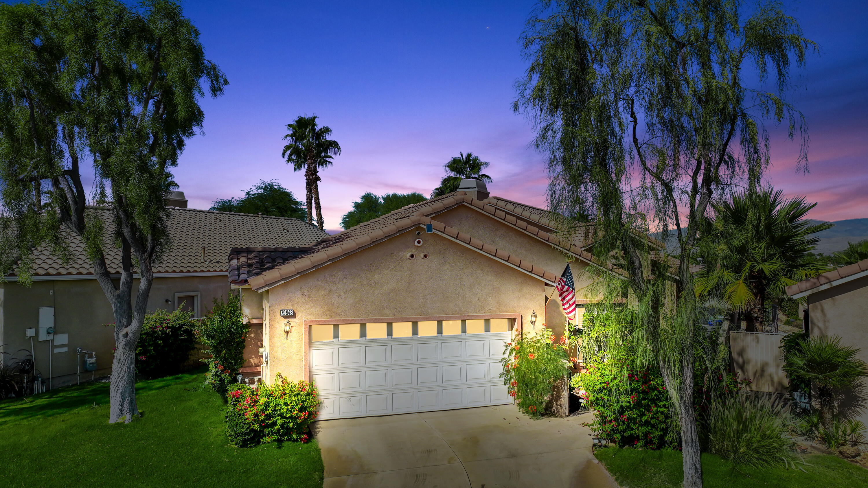 79948 Bethpage Avenue Indio, CA 92201 - Photo 2 of 30 a view of a house with a yard