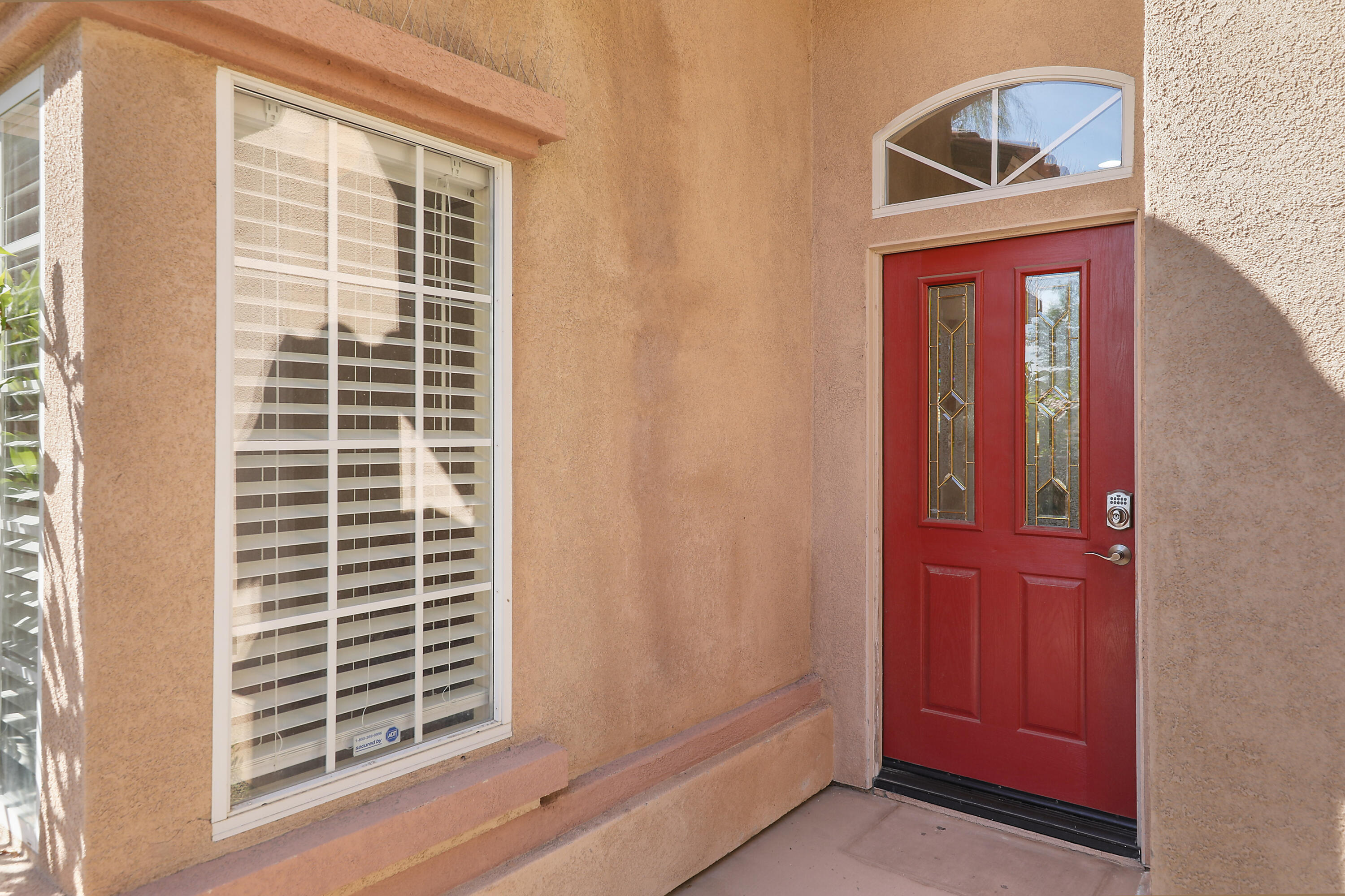 79948 Bethpage Avenue Indio, CA 92201 - Photo 3 of 30 a front view of a house with a door