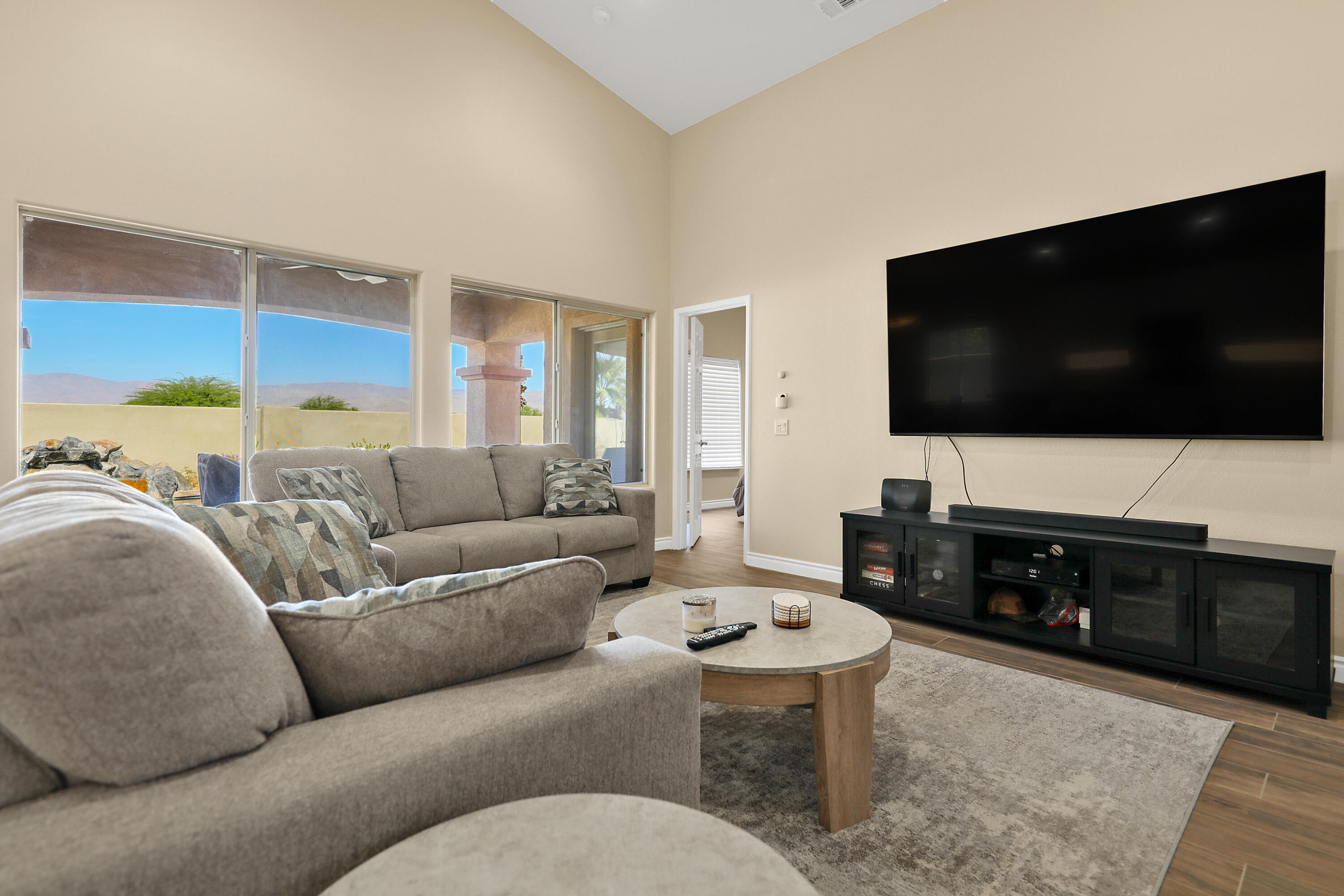 79948 Bethpage Avenue Indio, CA 92201 - Photo 7 of 30 a living room with furniture and a flat screen tv