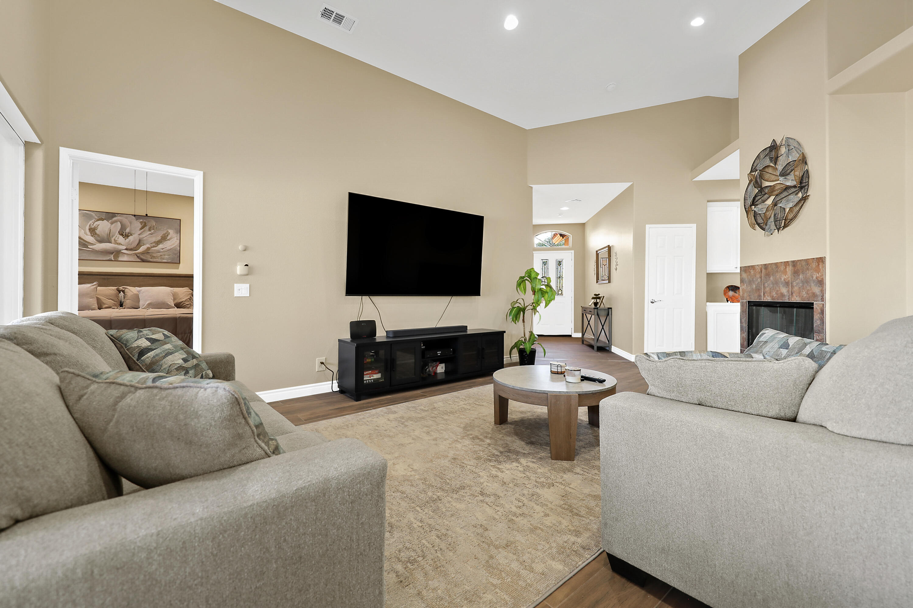 79948 Bethpage Avenue Indio, CA 92201 - Photo 8 of 30 a living room with furniture and a flat screen tv