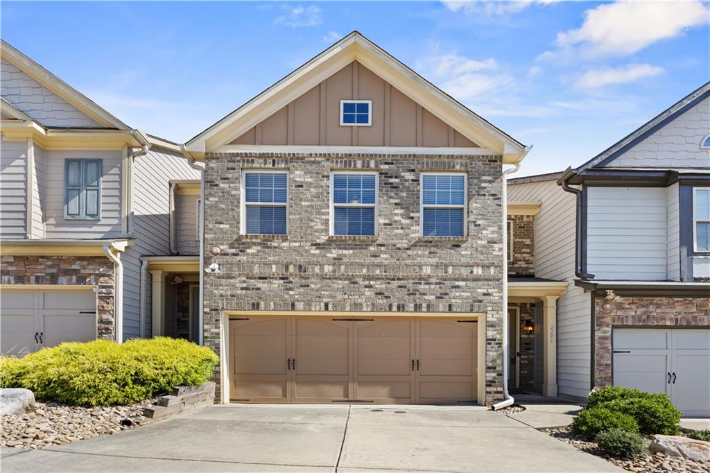 2296 Thackery Road Southwest Snellville, GA 30078 - Photo 1 of 26 a front view of a house with garden