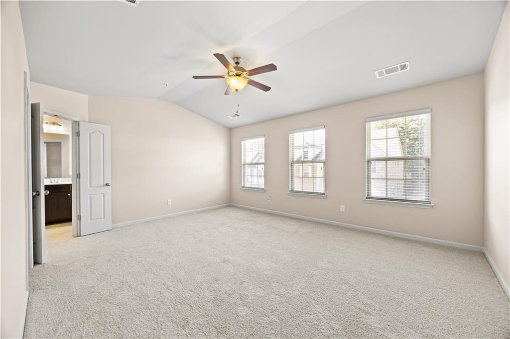 2296 Thackery Road Southwest Snellville, GA 30078 - Photo 14 of 26 a view of an empty room with a window
