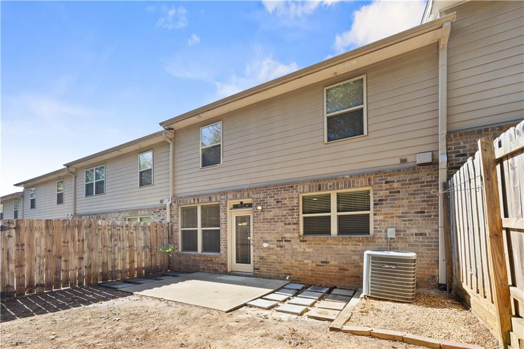 2296 Thackery Road Southwest Snellville, GA 30078 - Photo 23 of 26 a front view of a house with a yard