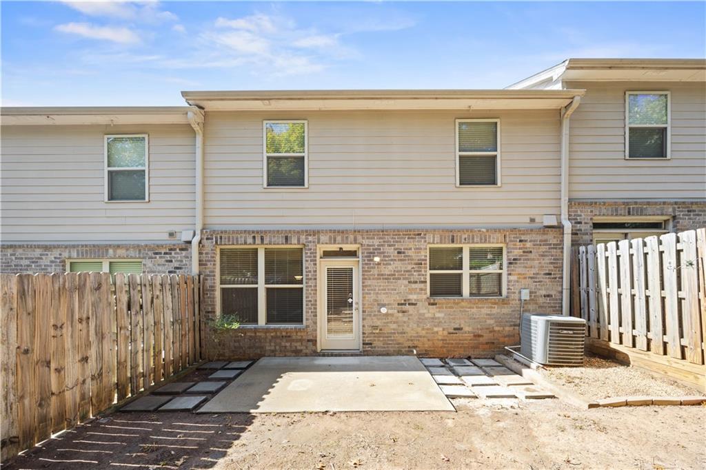 2296 Thackery Road Southwest Snellville, GA 30078 - Photo 25 of 26 a front view of a house with a blue gate