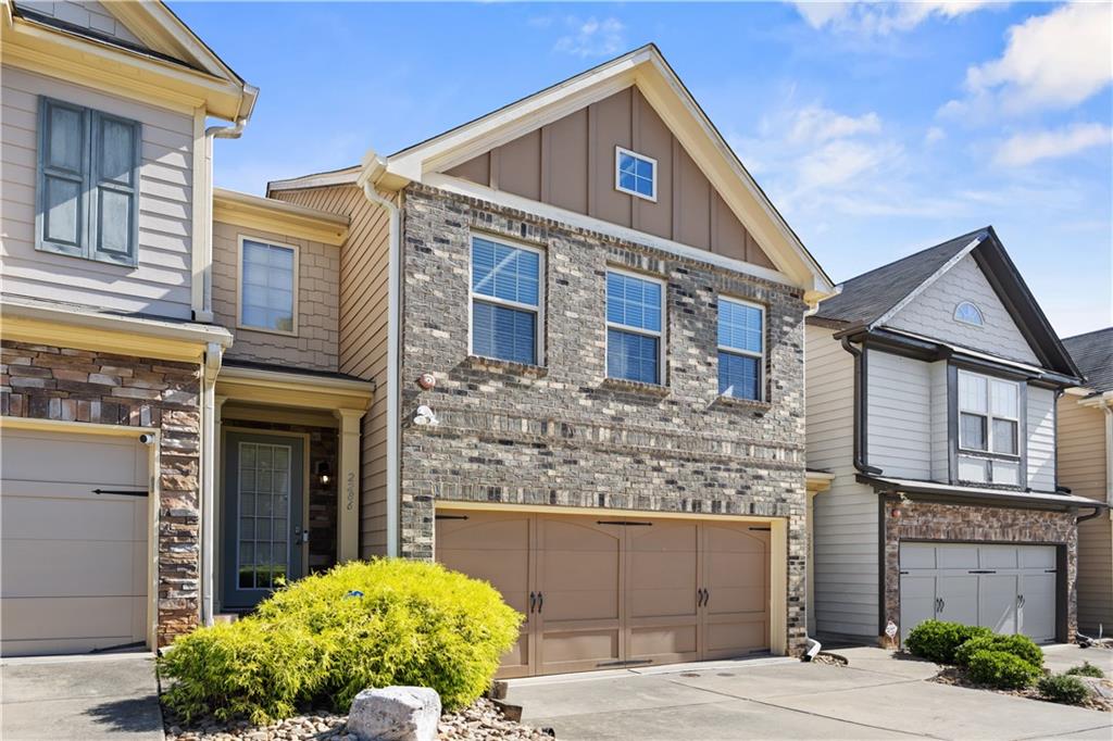2296 Thackery Road Southwest Snellville, GA 30078 - Photo 3 of 26 a front view of a house with garden