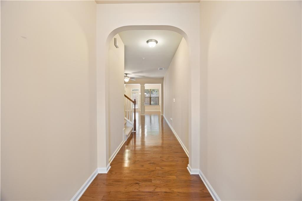 2296 Thackery Road Southwest Snellville, GA 30078 - Photo 4 of 26 a view of a hallway with wooden floor