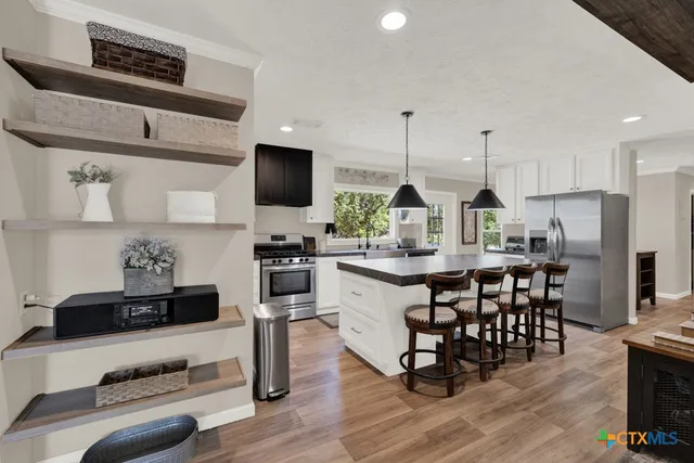 a living room with furniture or couch and a potted plant