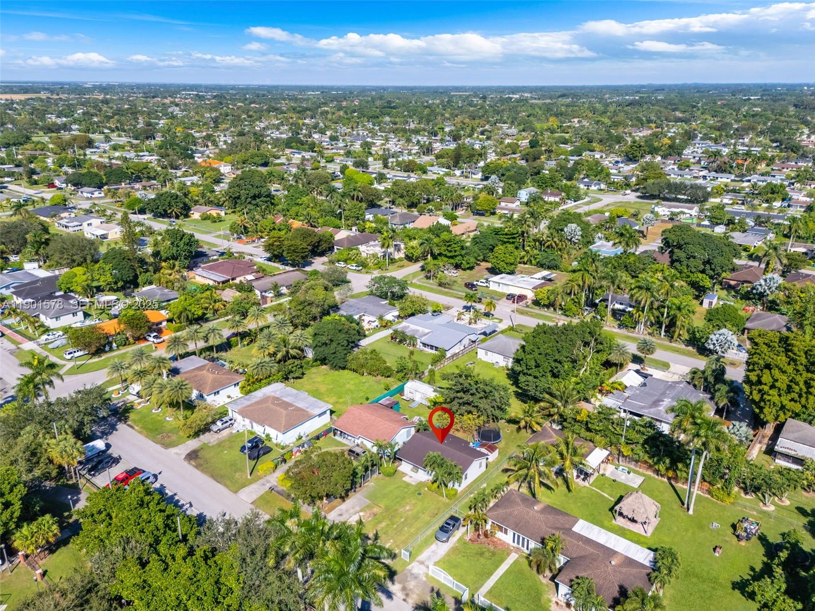 313 Northwest 12th Street Homestead, FL 33030 - Photo 15 of 16 an aerial view of residential houses with outdoor space and trees