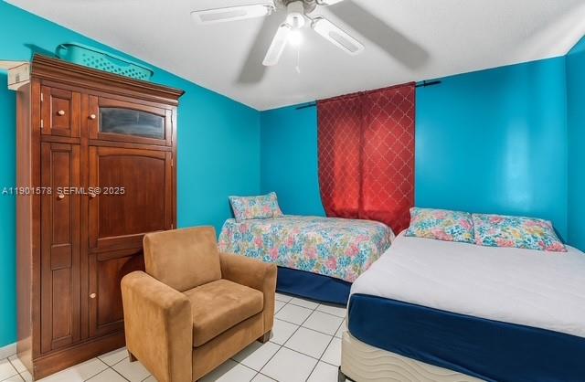 313 Northwest 12th Street Homestead, FL 33030 - Photo 10 of 16 a bedroom with a bed and a couch