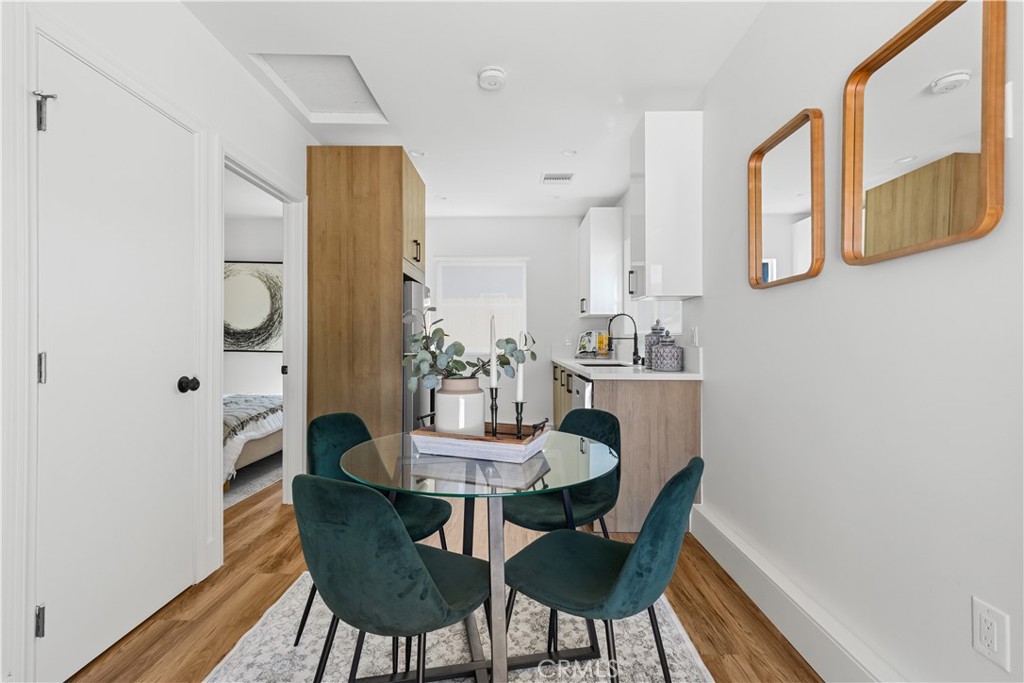 17801 Lanark Street Reseda, CA 91335 - Photo 15 of 17 a view of a dining room with furniture and wooden floor