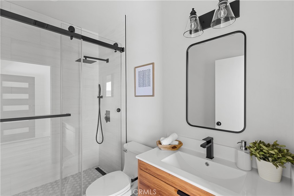 17801 Lanark Street Reseda, CA 91335 - Photo 17 of 17 a bathroom with a sink toilet and shower