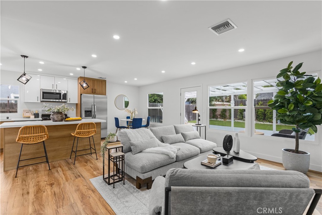 17801 Lanark Street Reseda, CA 91335 - Photo 4 of 17 a living room with furniture and a large window