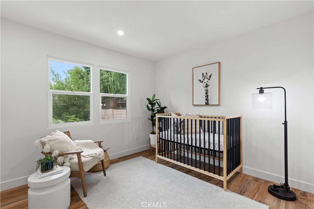 17801 Lanark Street Reseda, CA 91335 - Photo 7 of 17 a bedroom with furniture and a window