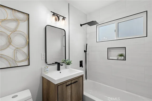 a bathroom with a sink vanity and a mirror