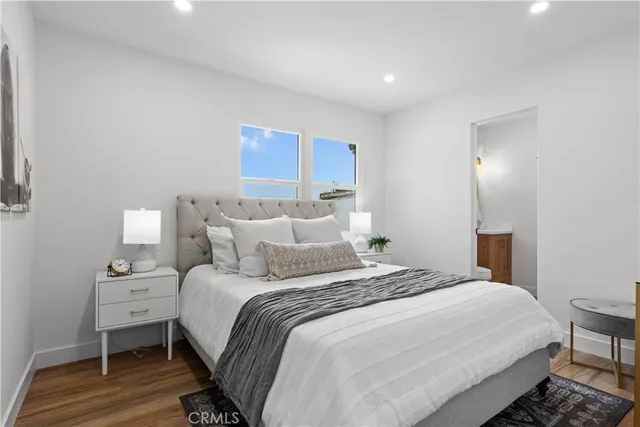 a bedroom with a bed and a lamp