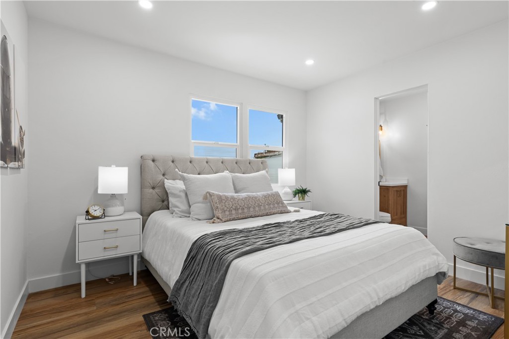 17801 Lanark Street Reseda, CA 91335 - Photo 10 of 17 a bedroom with a bed and a lamp