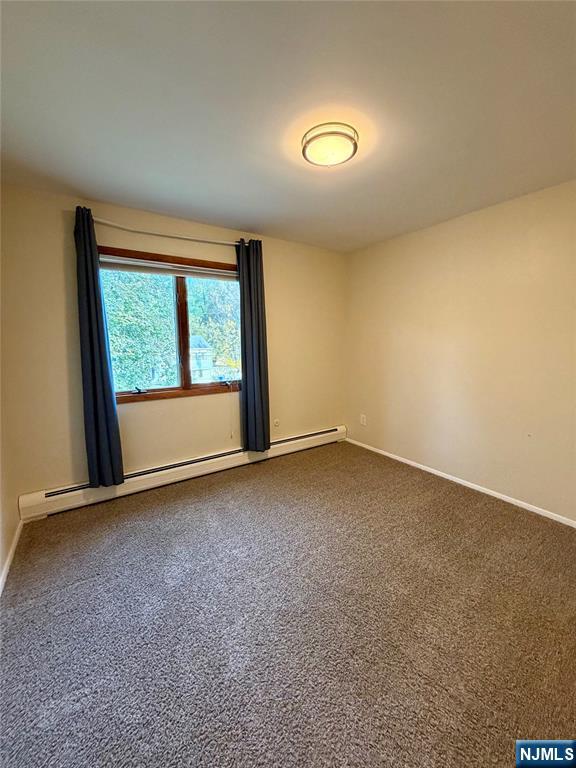 517 Fordham Place Paramus, NJ 07652 - Photo 17 of 25 an empty room with a window
