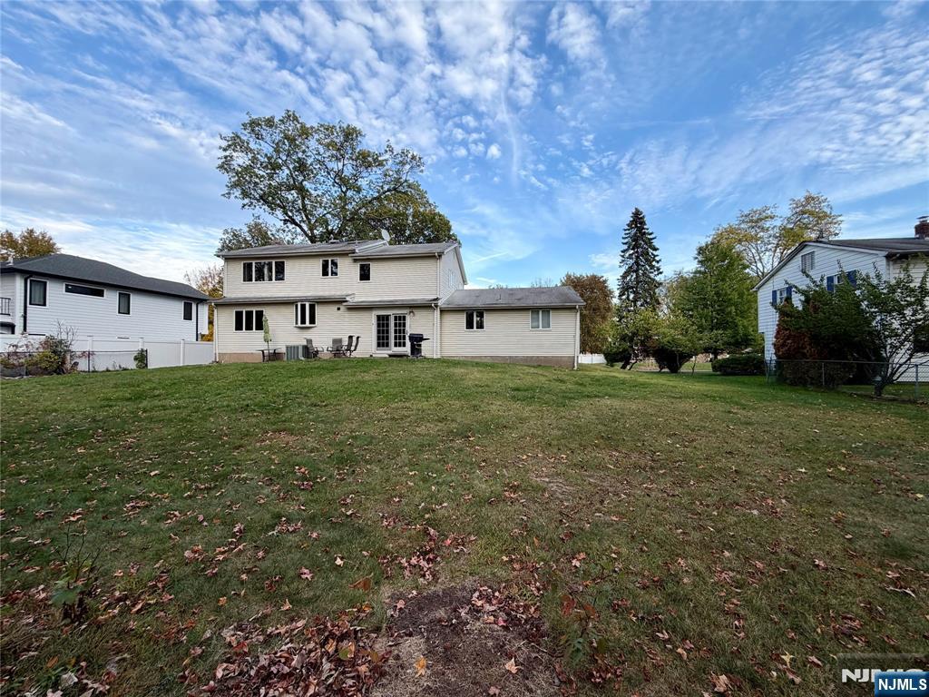 517 Fordham Place Paramus, NJ 07652 - Photo 25 of 25 a view of a house with a big yard and large trees