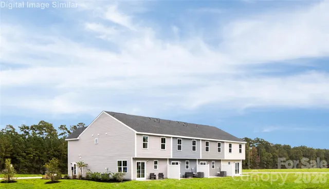 a view of house with yard