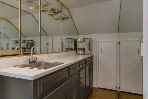 a kitchen with a sink and a refrigerator