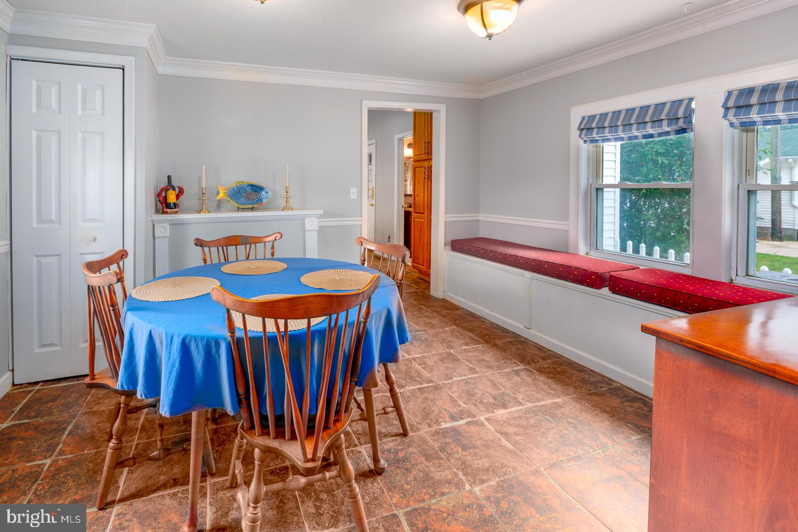4904 Ravenwood Road Vienna, MD 21869 - Photo 14 of 42 a view of a dining room with furniture and window