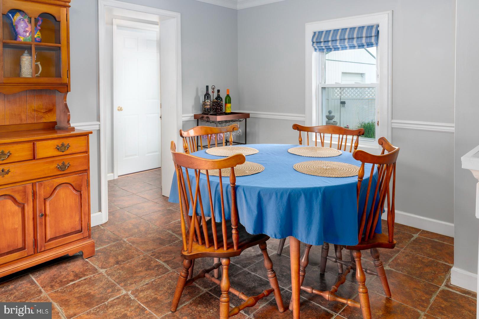 4904 Ravenwood Road Vienna, MD 21869 - Photo 15 of 42 a view of a dining room with furniture