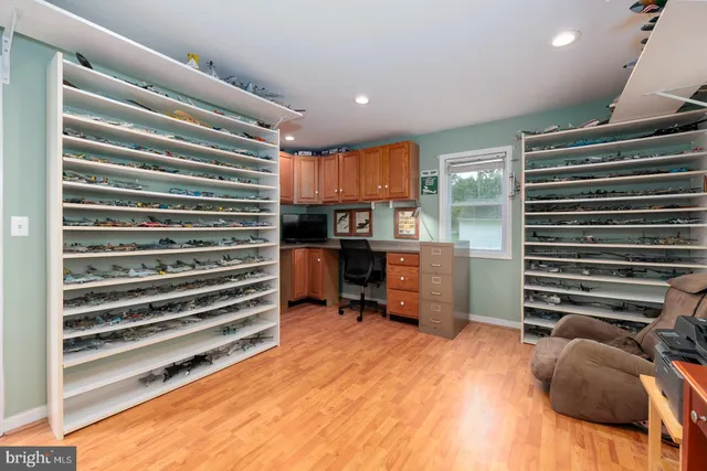 a workspace with furniture and a flat screen tv