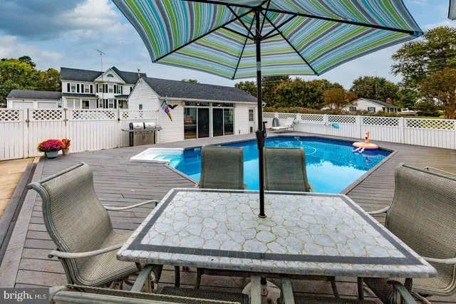 a bedroom with furniture and a flat screen tv