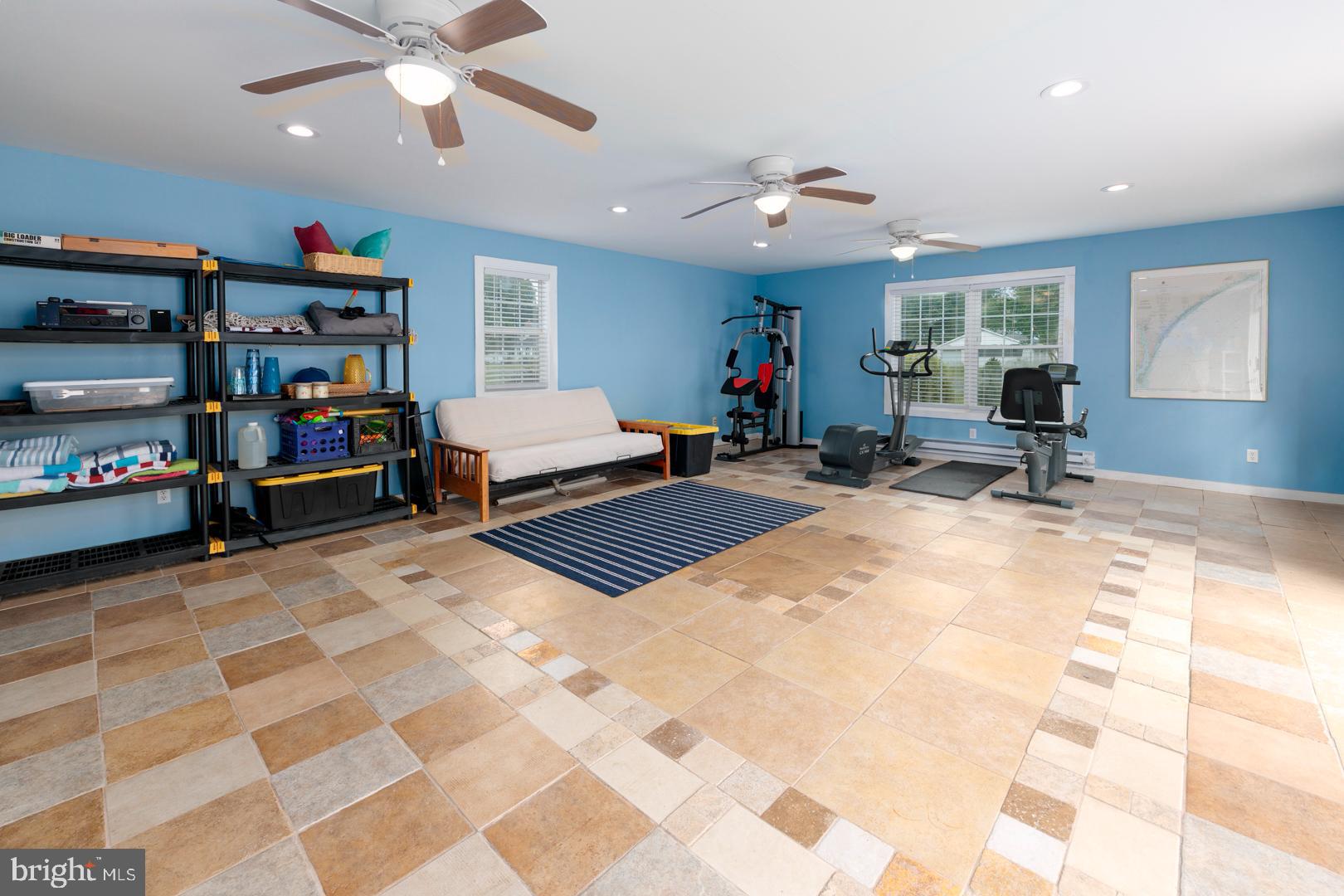 4904 Ravenwood Road Vienna, MD 21869 - Photo 32 of 42 a bedroom with furniture and a flat screen tv