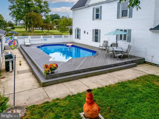 a view of a backyard with plants and garden