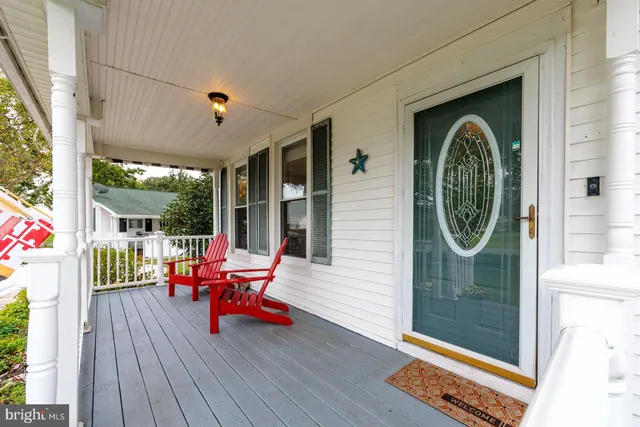 a chair and table sitting in front of a window
