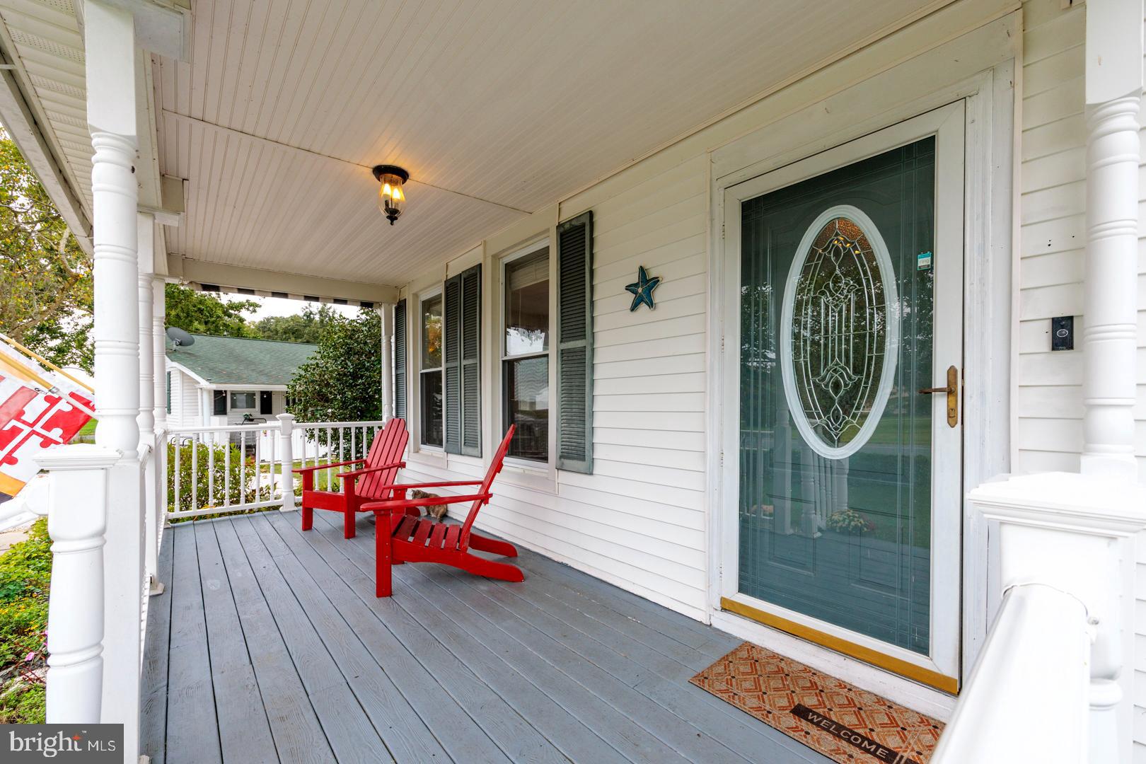 4904 Ravenwood Road Vienna, MD 21869 - Photo 6 of 42 a chair and table sitting in front of a window