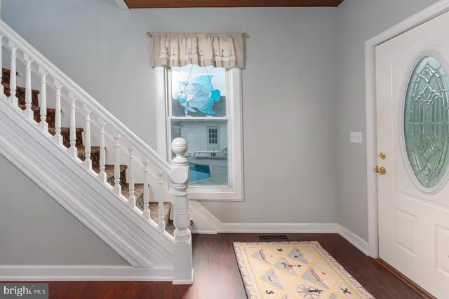 a view of entryway with wooden floor